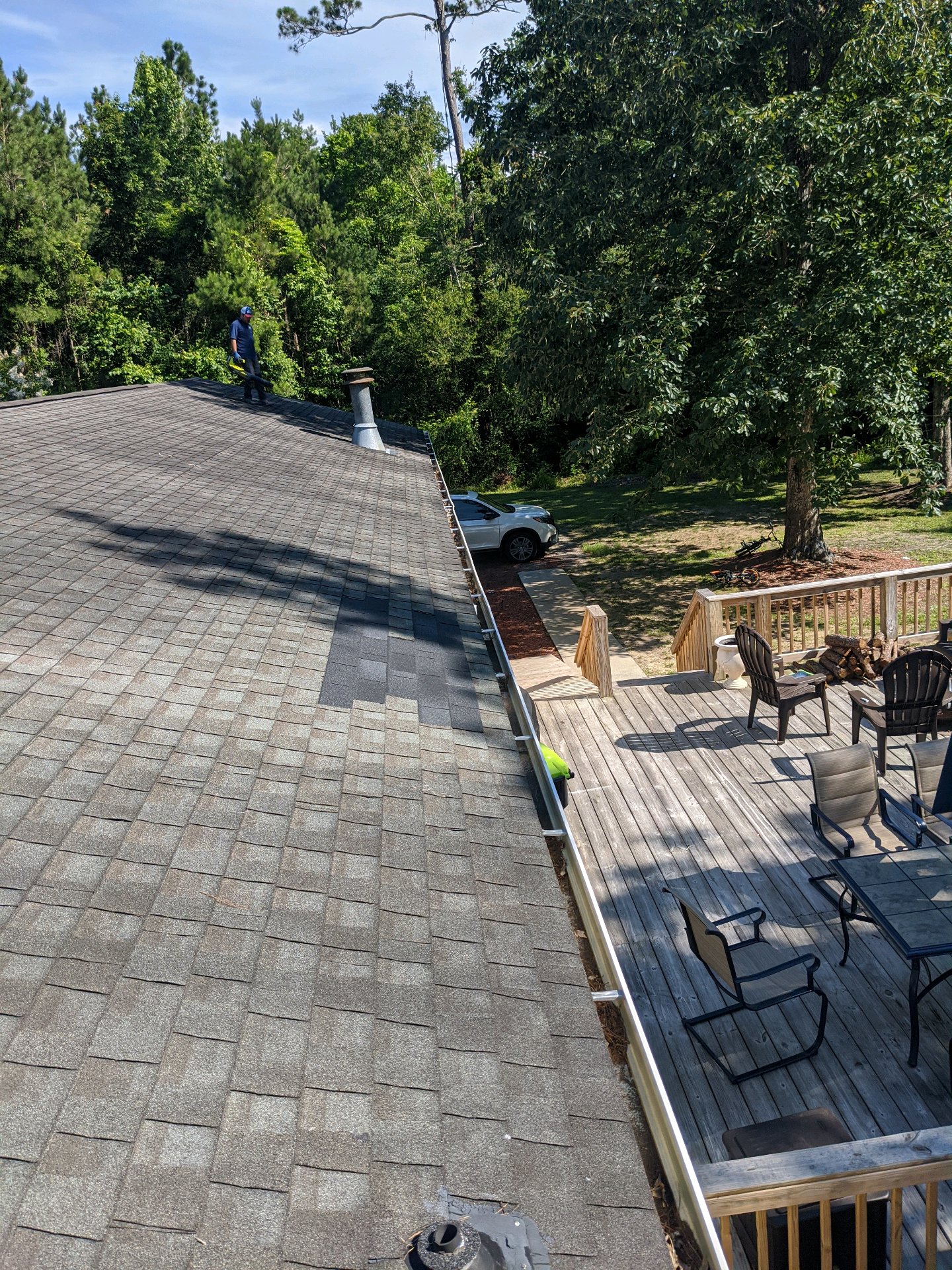 Wilmington-area gutter guard installation in progress along a residential roofline